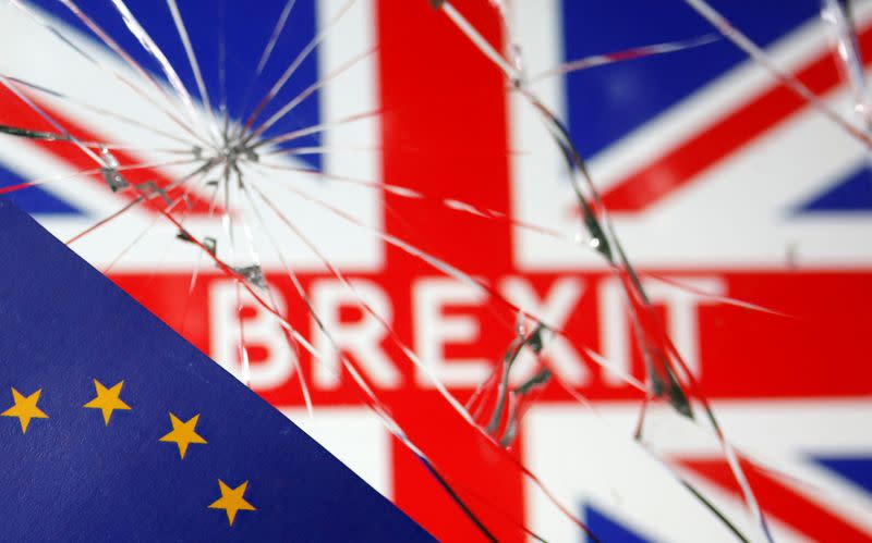 EU flag are placed on broken glass and British flag in this illustration picture taken