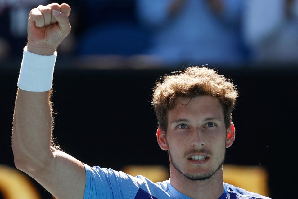 Spain's Pablo Carreno Busta celebrates after winning against Netherlands' Tallon Griekspoor during their men's singles match on day three of the Australian Open tennis tournament in Melbourne on January 19, 2022. - -- IMAGE RESTRICTED TO EDITORIAL USE - STRICTLY NO COMMERCIAL USE -- (Photo by Brandon MALONE / AFP) / -- IMAGE RESTRICTED TO EDITORIAL USE - STRICTLY NO COMMERCIAL USE -- (Photo by BRANDON MALONE/AFP via Getty Images)