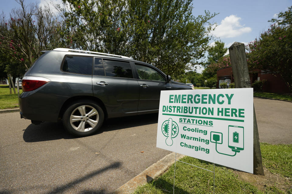 A Jackson, Miss., resident drives to the Tougaloo Community Center, Thursday, June 29, 2023, where the City of Jackson located one of six cooling centers. An oppressive heat wave blamed for at least 13 deaths in Texas and one in Louisiana is blanketing the South and the National Weather Service issued an excessive heat warning for parts of the Deep South on Friday, with a heat index expected to reach 115 degrees in several cities. (AP Photo/Rogelio V. Solis)