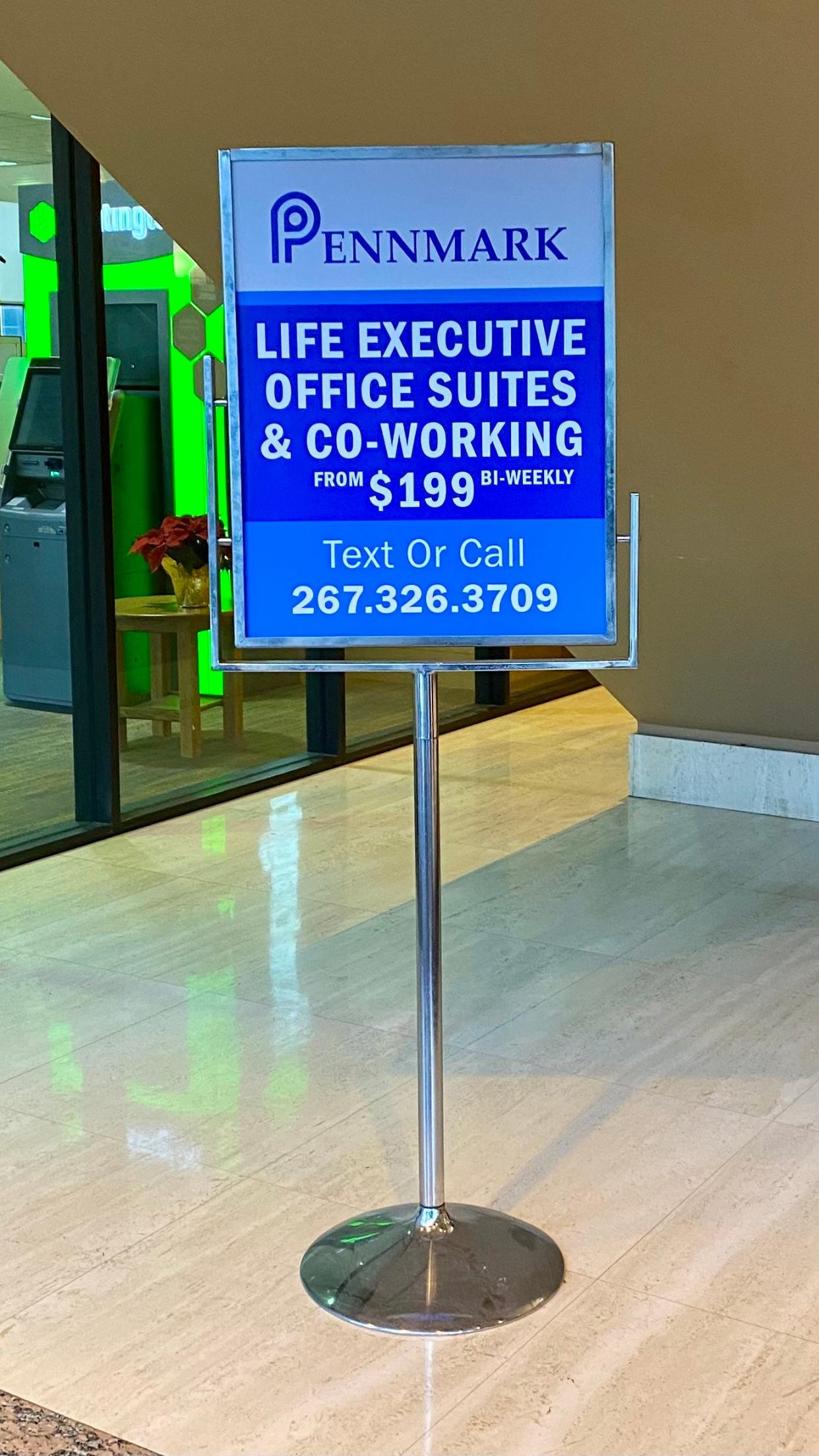 A sign in the Huntington Plaza lobby advertises office space for lease.