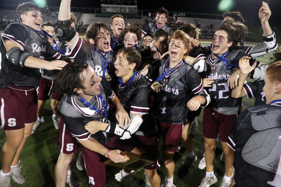 Scarsdale lacrosse players celebrates their 12-7 victory over Mamaroneck in  the Section 1 Class A championship game at Lakeland High School in Shrub Oak May 27, 2022. 