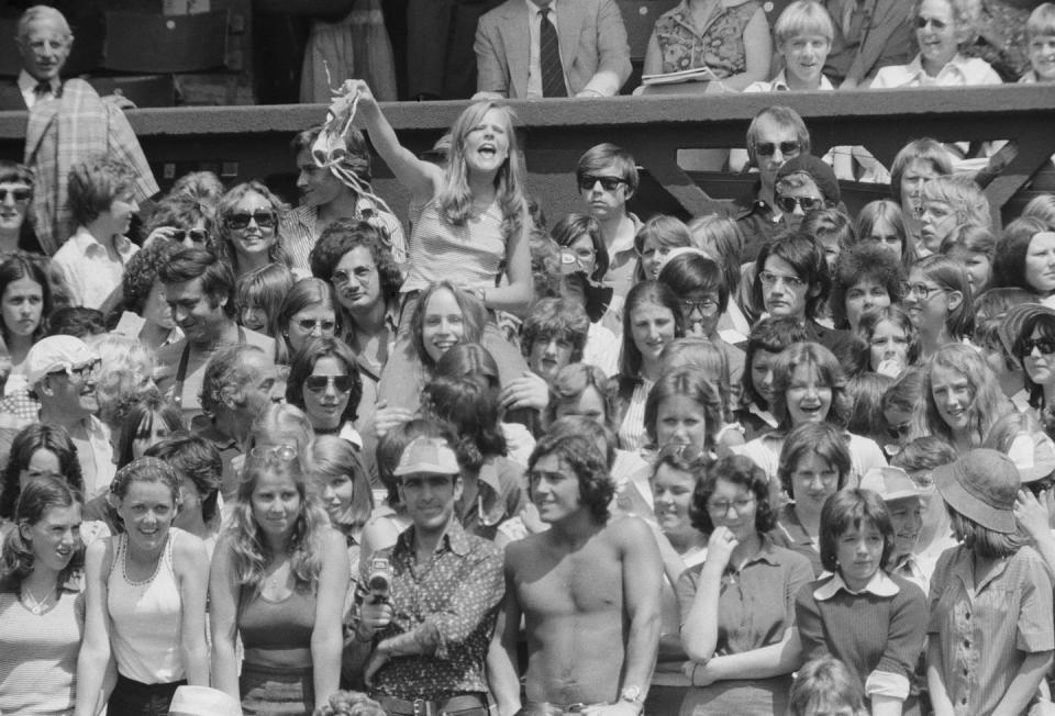 <p>A fan waves an item of underwear at Bjorn Borg on Centre Court at Wimbledon in June 1975.</p>