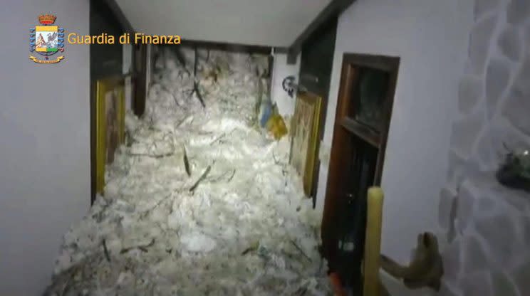 This image made available by the Italian Guardia di Finanza finance police shows the avalanche inside the Rigopiano Hotel, near Farindola, Italy, Thursday, Jan. 19, 2017. Rescue workers reported no signs of life Thursday at a four-star hotel buried by an avalanche in the mountains of earthquake-stricken central Italy. (Guardia di Finanza/ANSA via Finance Police)