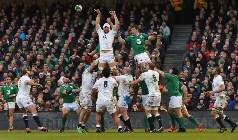 England lock Dave Attwood (C) wins the line-out ball during the Six Nations match against Ireland at Aviva Stadium on March 1, 2015