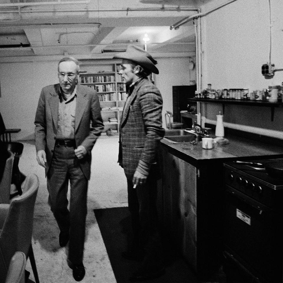 <p>Writer William S. Burroughs lived at 222 Bowery on Manhattan's Lower East Side in an apartment dubbed "The Bunker" (for obvious reasons, per this photograph). He's pictured with actor and filmmaker Dennis Hopper (right) here. </p>