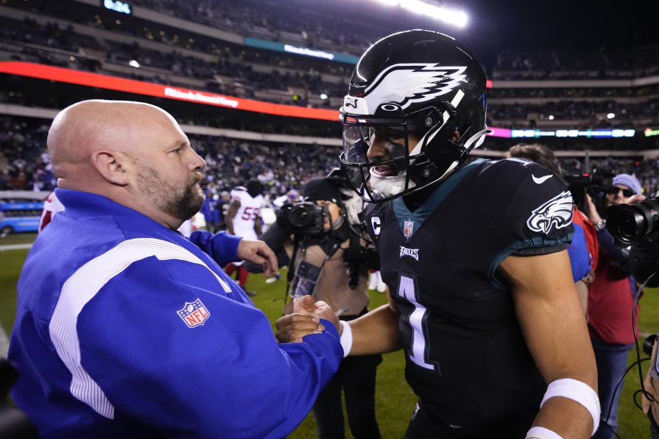 New York Giants head coach Brian Daboll, left, talks with Philadelphia Eagles quarterback Jalen Hurts following an NFL football game, Sunday, Jan. 8, 2023, in Philadelphia. The Eagles won 22-16. (AP Photo/Matt Slocum)