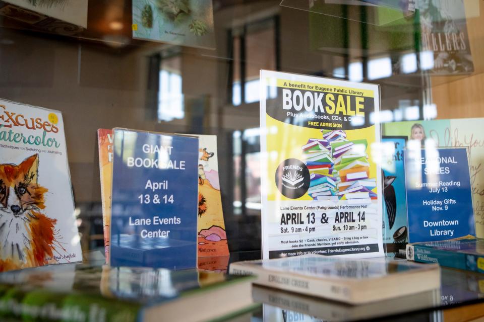 A sign advertises the Friends of Eugene Public Library book sale at the Lane County Fairgrounds this weekend.