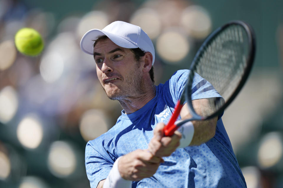 Andy Murray, of Britain, returns a shot to Carlos Alcaraz, of Spain, at the BNP Paribas Open tennis tournament Sunday, Oct. 10, 2021, in Indian Wells, Calif. (AP Photo/Mark J. Terrill)