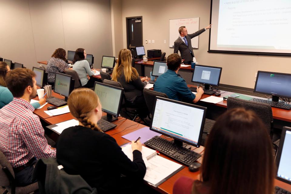 Employees attend a training class at Paycom's campus in northwest Oklahoma City in this 2016 photo.
