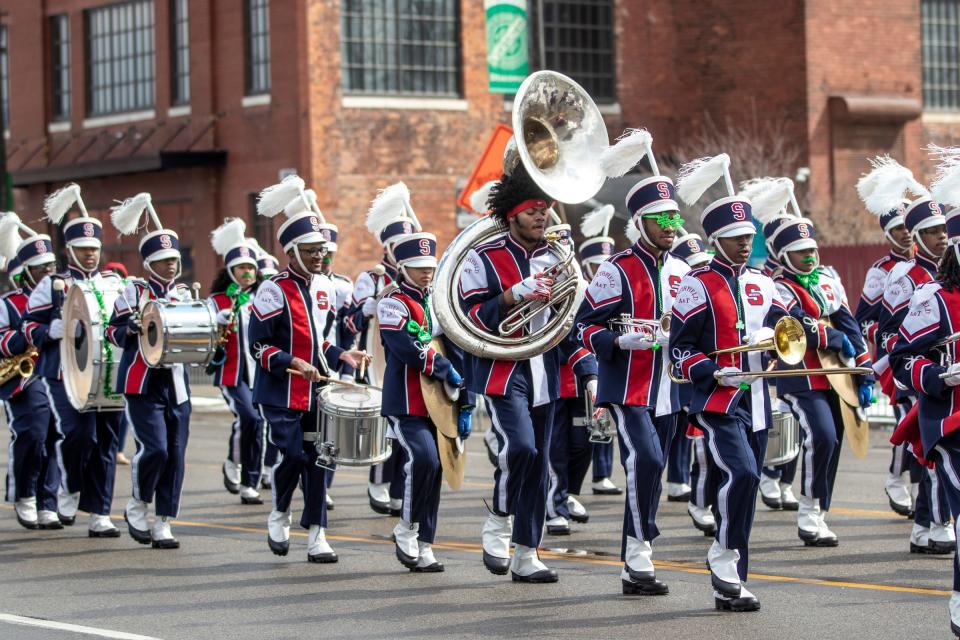 Members of the Southfield High School for the Arts and Technology marching band perform during the St. Patrick's Parade along Michigan Avenue in Detroit's Corktown on Sunday, March 13, 2022.