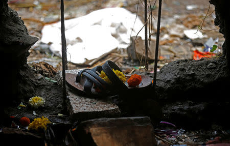 A sandle of one of the victims of a stampede is seen below a railway station's pedestrian overbridge in Mumbai, India September 29, 2017. REUTERS/Shailesh Andrade