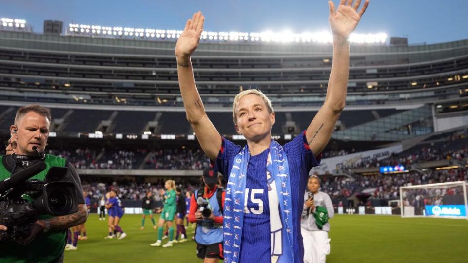 megan rapinoe raising her arms to thank fans following her final match with the uswnt