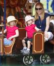 <p>Princess Anne's daughter-in-law, Autumn Phillips, takes daughters Savannah and Isla on a train-themed merry-go-round at the Royal Windsor Horse Show. </p>