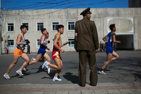 Pyongyang marathon runners - Credit: David Guttenfelder