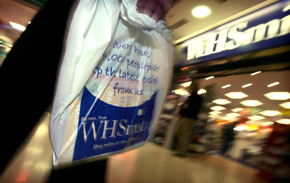 A general view of someone holding a WH Smith bag outside a store in Bristol.