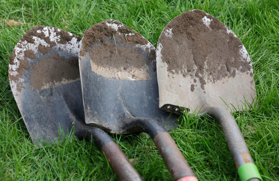 Shovels are coated with soil following the transplant project that Sheboygan North students did, Saturday, April 22, 2023, in Sheboygan Falls, Wis..