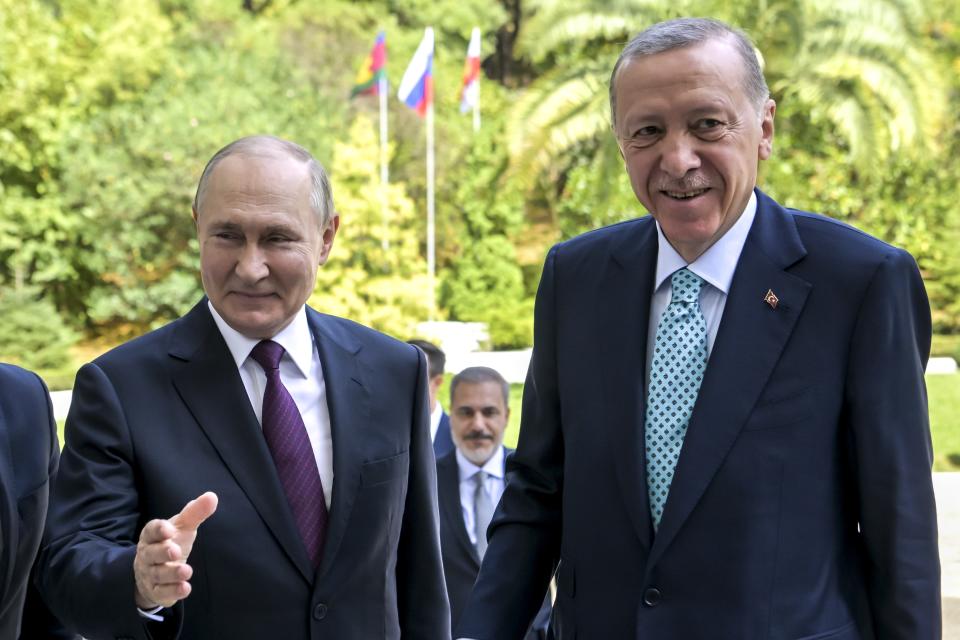 Russian President Vladimir Putin, left, welcomes Turkish President Recep Tayyip Erdogan for the talks at Russia's Black Sea resort of Sochi, Russia, Monday, Sept. 4, 2023. (Alexei Nikolsky, Sputnik, Kremlin Pool Photo via AP)