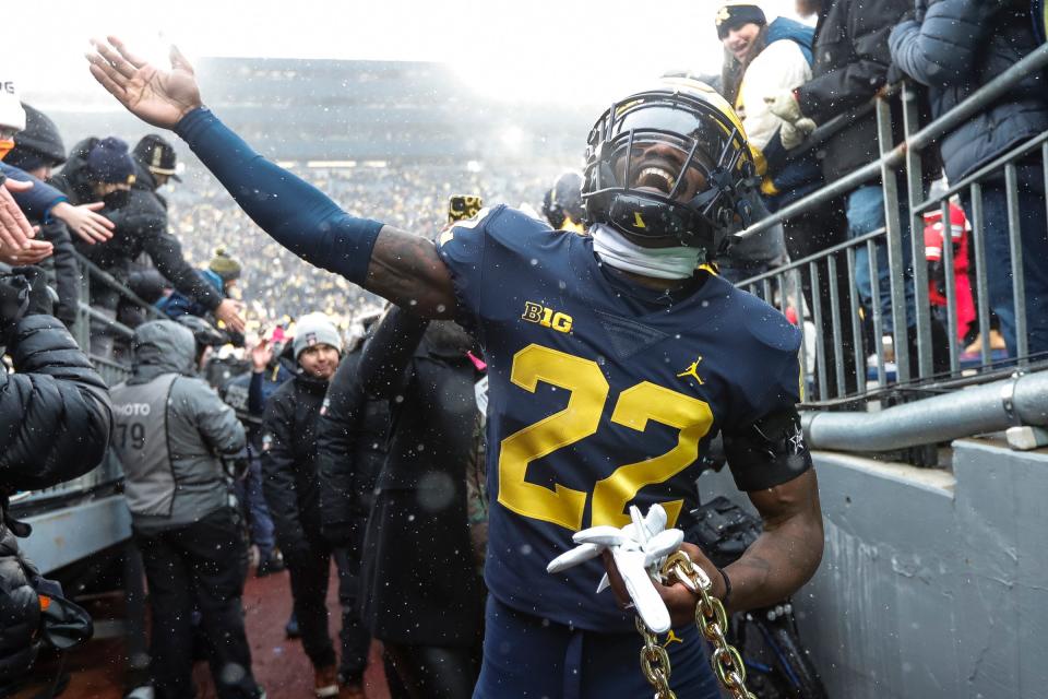 Michigan defensive back Gemon Green celebrates with fans as he walks up the tunnel after Michigan's 42-27 win over Ohio State on Saturday, Nov. 27, 2021, at Michigan Stadium.