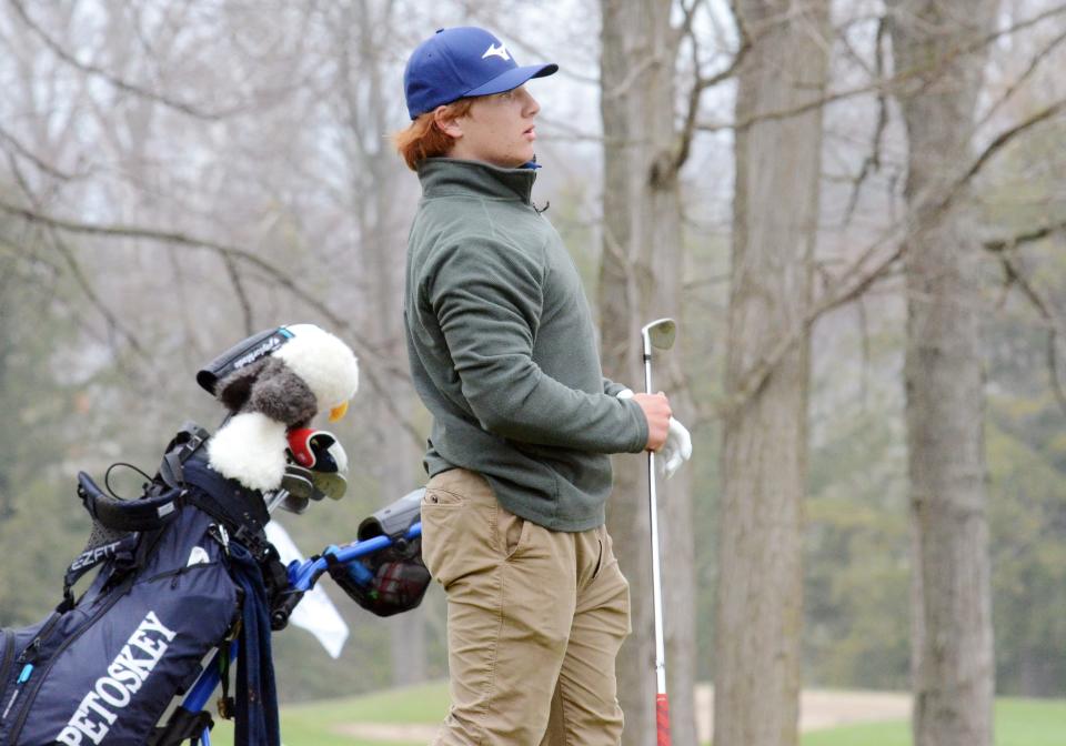 Petoskey'sCollin Caporosso watches his shot during the annual Petoskey Invite on Monday at the Petoskey-Bay View Country Club.