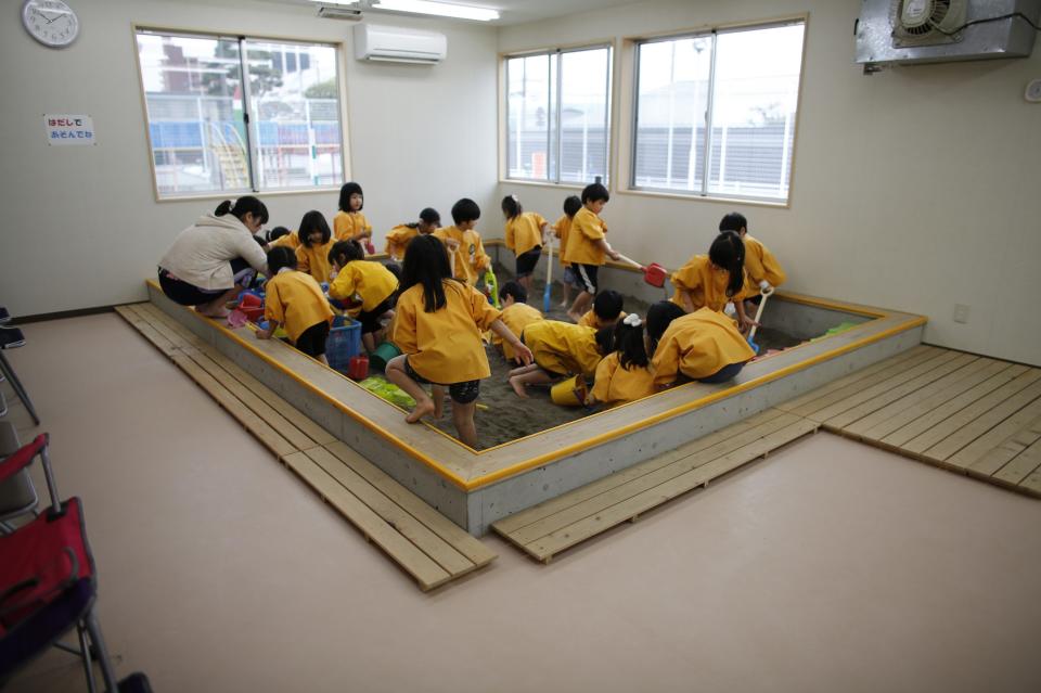 Children play at an indoor sand pit of the Emporium kindergarten in Koriyama, west of the tsunami-crippled Fukushima Daiichi nuclear power plant, Fukushima prefecture February 28, 2014. (REUTERS/Toru Hanai)