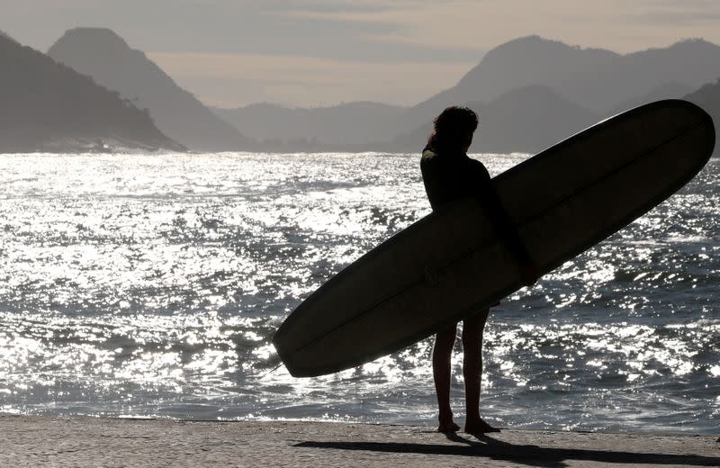 FILE PHOTO: A surfer is seen at Copacabana beach in Rio de Janeiro