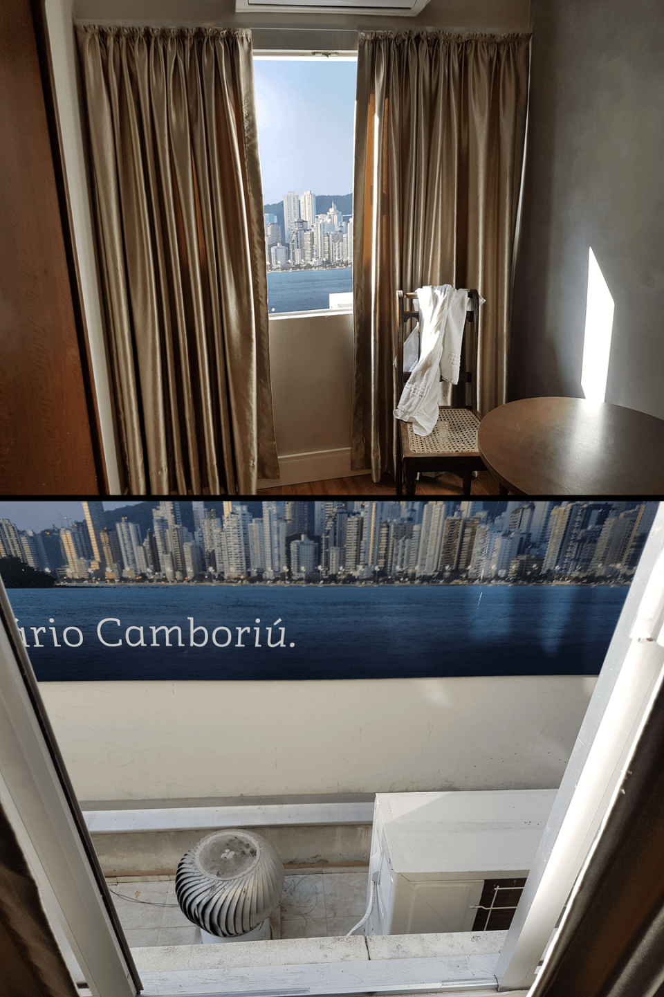 Hotel room with a framed panoramic view of Balneário Camboriú and a towel on a chair