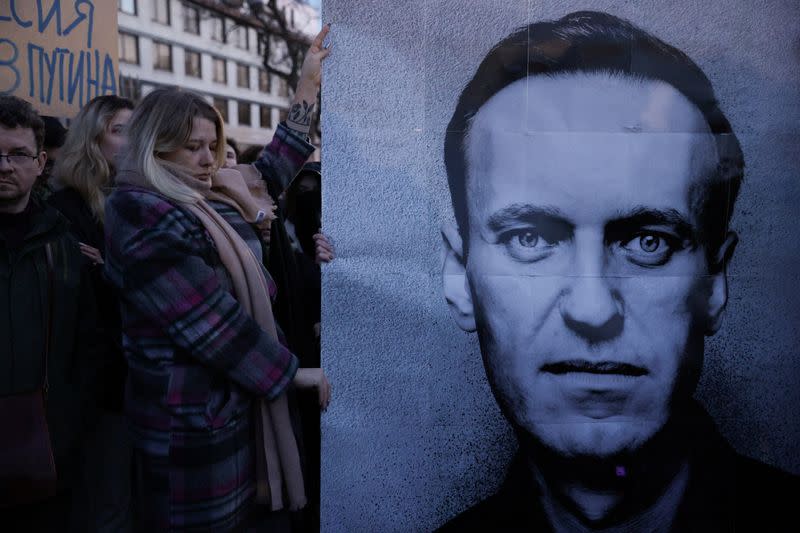 People demonstrate following the death of Russian opposition leader Alexei Navalny, in Warsaw