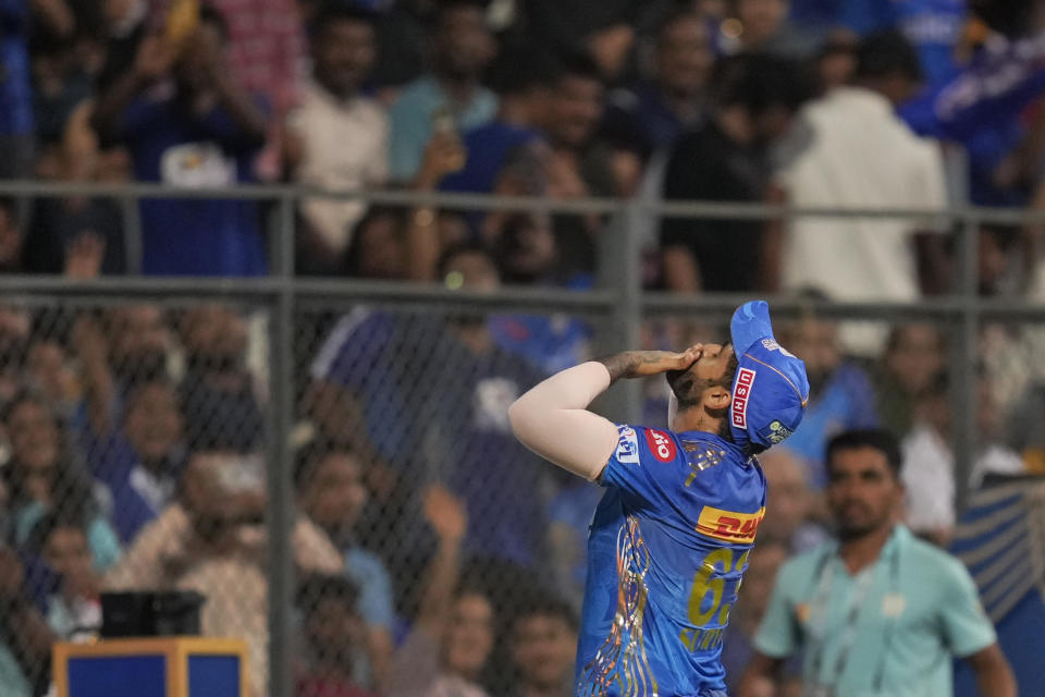 Mumbai Indians' Suryakumar Yadav blows a kiss at his fans during the Indian Premier League cricket match between Mumbai Indians and Gujrat Titans in Mumbai, India, Friday, May 12, 2023. (AP Photo /Rajanish Kakade)