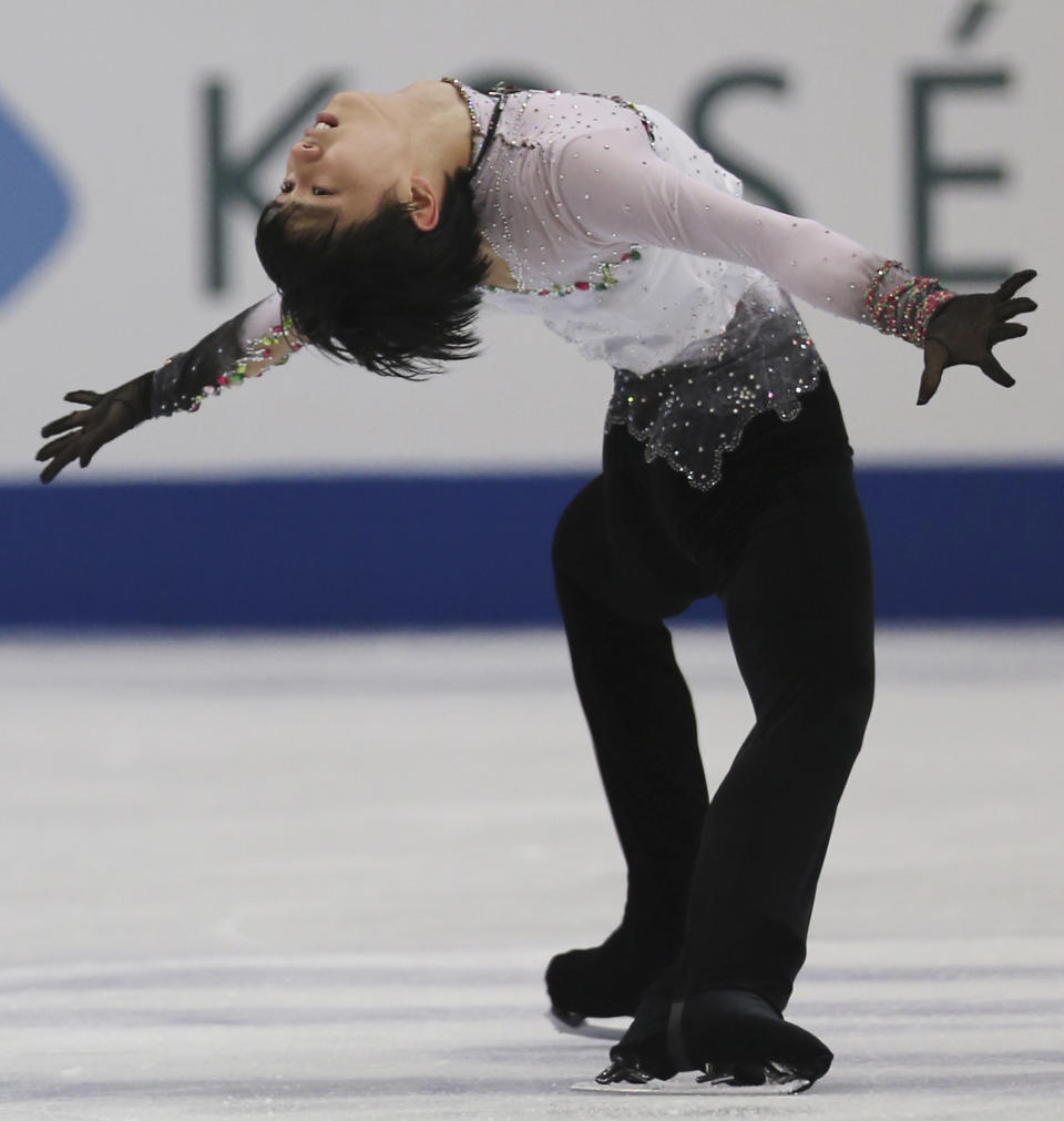 Yuzuru Hanyu of Japan performs during the men's free skating in the World Figure Skating Championships in Saitama, near Tokyo, Friday, March 28, 2014. Hanyu barely topped the free skate to become the first man in 12 years on Friday to win the Olympic and world figure skating titles in the same year. (AP Photo/Koji Sasahara)