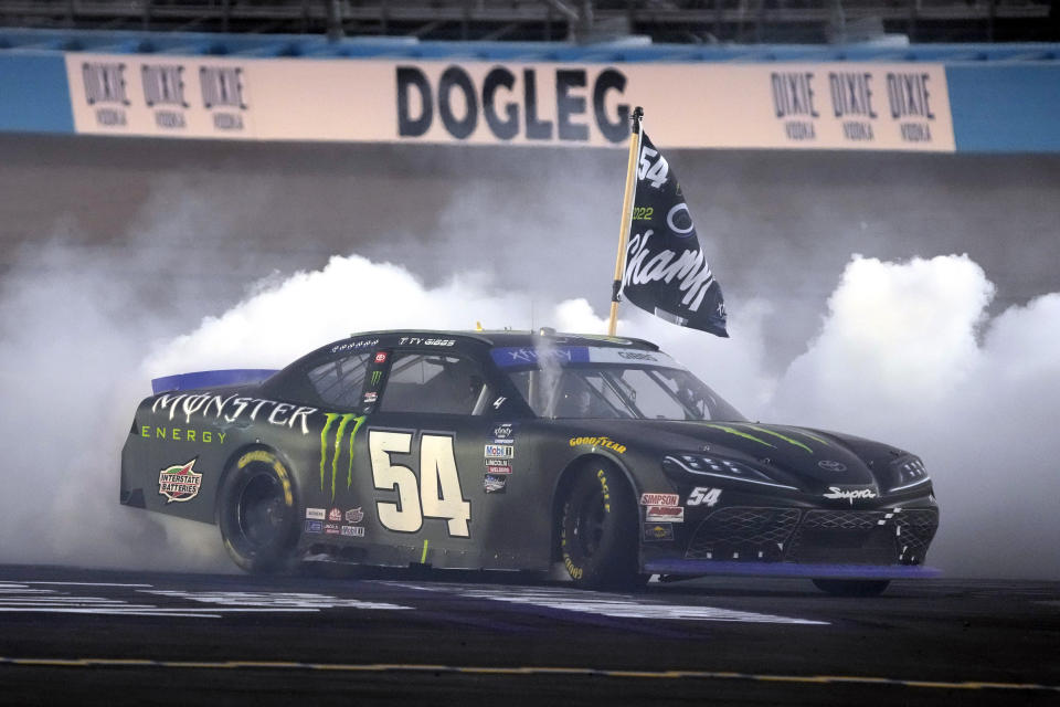 Ty Gibbs does a burnout after winning the NASCAR Xfinity Series auto race and the season championship Saturday, Nov. 5, 2022, in Avondale, Ariz. (AP Photo/Rick Scuteri)