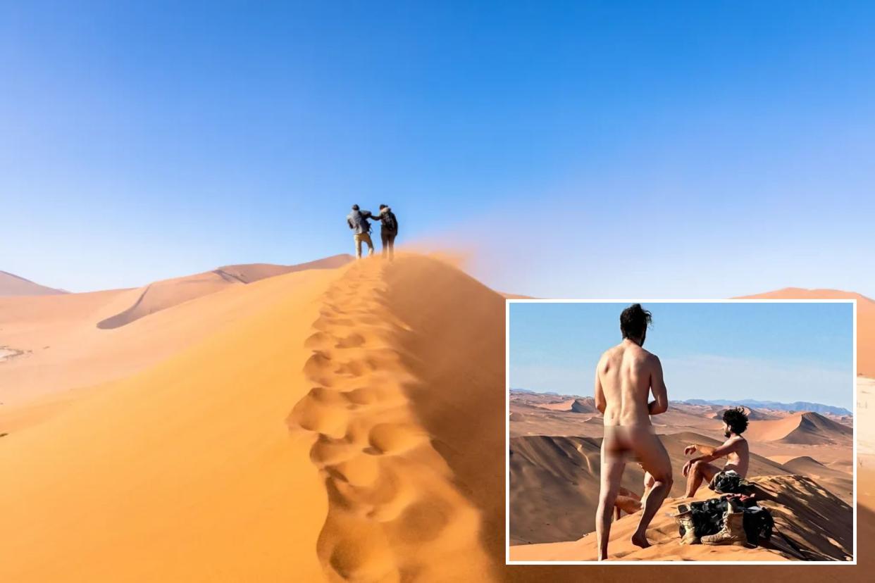 A group of people on a sand dune