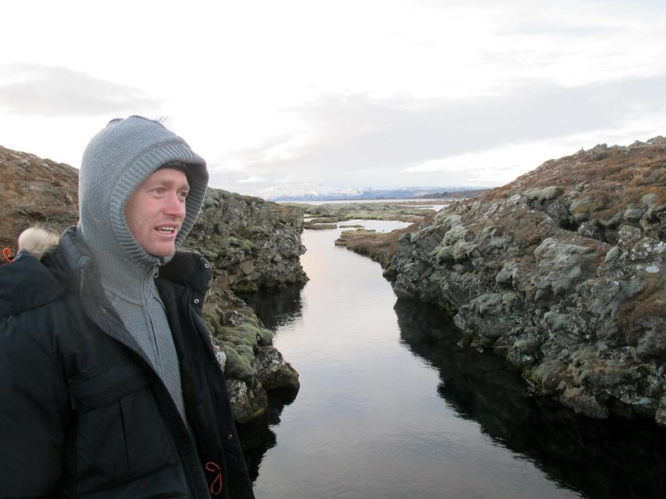 In this Jan. 23, 2013 photo, Louis Kotze of DIVE.IS gives instructions to snorkelers at Iceland’s Silfra rift. Silfra, fed by glacial water, has become a popular site for diving and snorkeling despite near-freezing temperatures. (AP Photo/Jim Heintz)