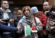 Belarussian author Svetlana Alexievich (C) answers journalists' questions after a news conference in Minsk, Belarus, October 8, 2015. REUTERS/Vasily Fedosenko