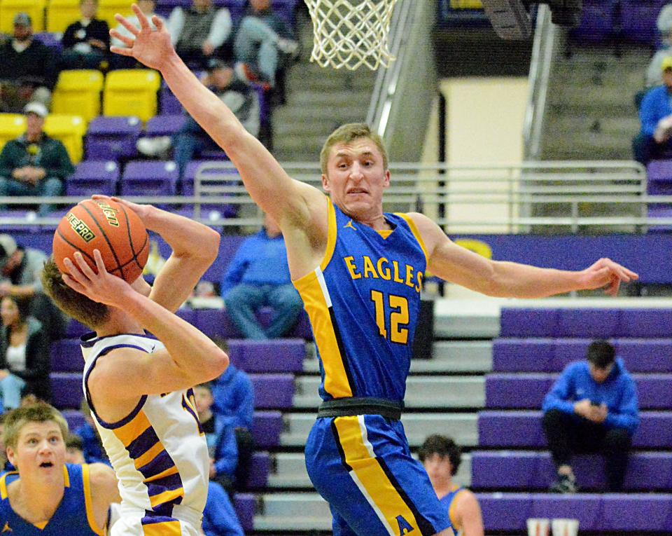 Aberdeen Central's Spencer Barr attempts to block a shot attempt by Watertown's Kohen Kranz during their high school boys basketball game on Tuesday, Jan. 10, 2023 in the Watertown Civic Arena. Watertown won 48-30.