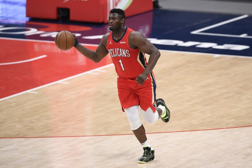 New Orleans Pelicans forward Zion Williamson (1) dribbles the ball during the second half of an NBA basketball game against the Washington Wizards, Friday, April 16, 2021, in Washington. (AP Photo/Nick Wass)