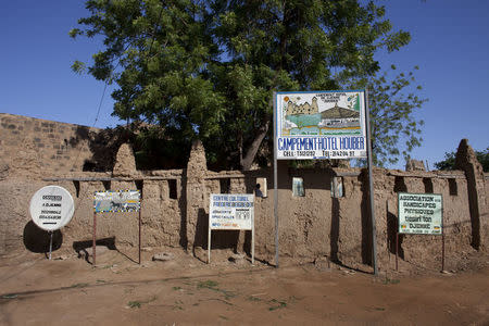 Signs for hotels and tourist attractions line the road in Djenne September 1, 2012. REUTERS/Joe Penney