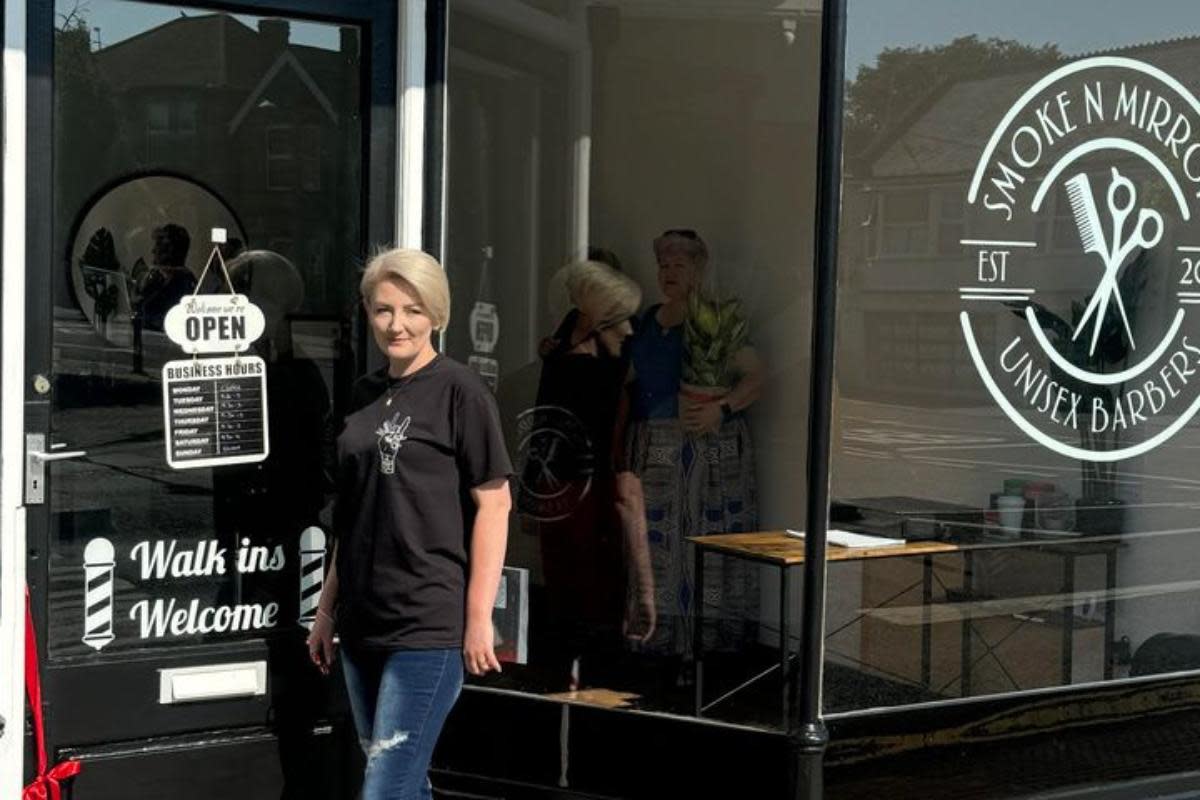 Hope Price outside her new barbers in East Cowes. <i>(Image: Contributed)</i>