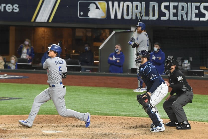 The Dodgers' Corey Seager hits a go-ahead single in the eighth inning against the Rays in Game 4 of the World Series.
