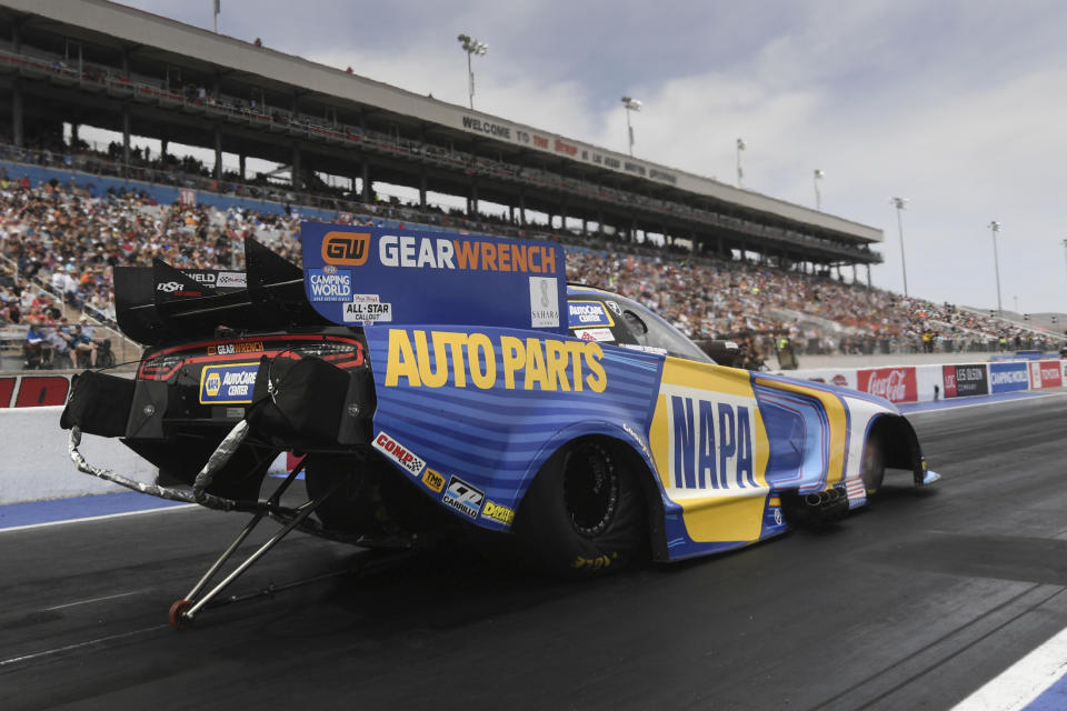 In this photo provided by the NHRA, Ron Capps gets ready for a run in Funny Car at the NHRA Four-Wide Nationals drag races at The Strip at Las Vegas Motor Speedway on Sunday, April 3, 2022, in Las Vegas. (Marc Gewertz/NHRA via AP)