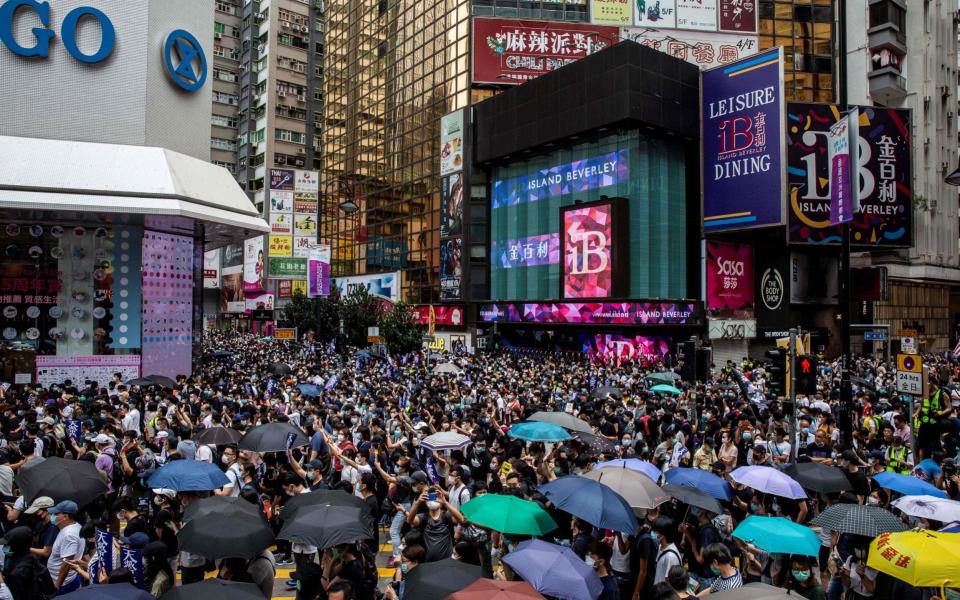 Pro-democracy protesters gather in Causeway Bay district of Hong Kong on May 24, 2020, ahead of planned protests against a proposal to enact new security legislation in Hong Kong. - The proposed legislation is expected to ban treason, subversion and sedition, and follows repeated warnings from Beijing that it will no longer tolerate dissent in Hong Kong,  - AFP