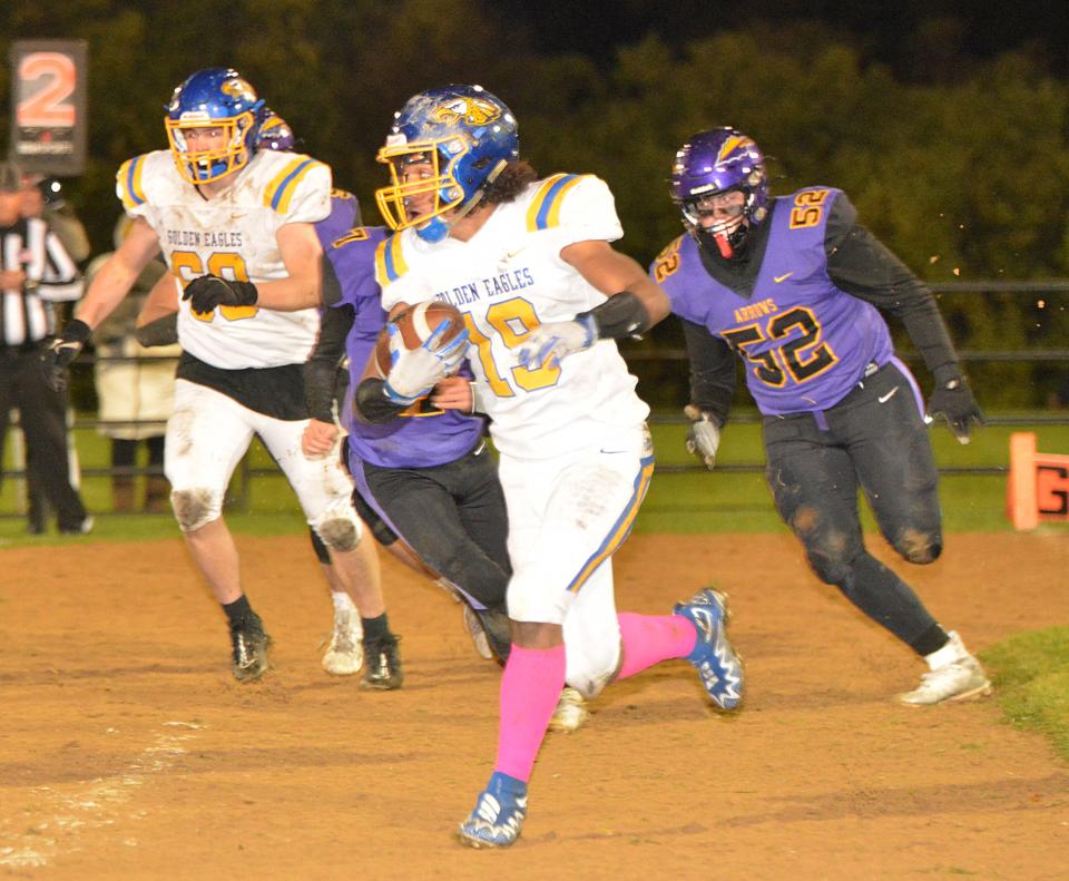 Aberdeen Central's Avery Ligon picks up some rushing yardage during a first-round game in the state Class 11AA high school football playoffs on Thursday, Oct. 26, 2023 at Watertown Stadium.