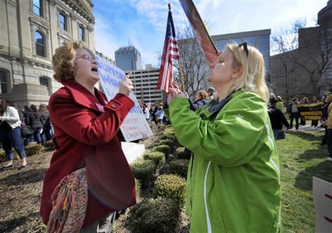 The issue went from breast cancer to politics after Susan G. Komen For the Cure cut funding to Planned Parenthood. (AP Photo/The Indianapolis Star, Alan Petersime)