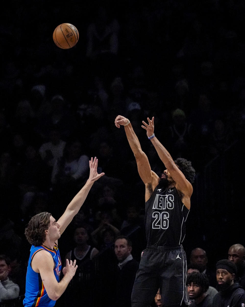 Brooklyn Nets guard Spencer Dinwiddie (26) shoots over Oklahoma City Thunder guard Josh Giddey during the first half of an NBA basketball game in New York, Friday, Jan. 5, 2024. (AP Photo/Peter K. Afriyie)