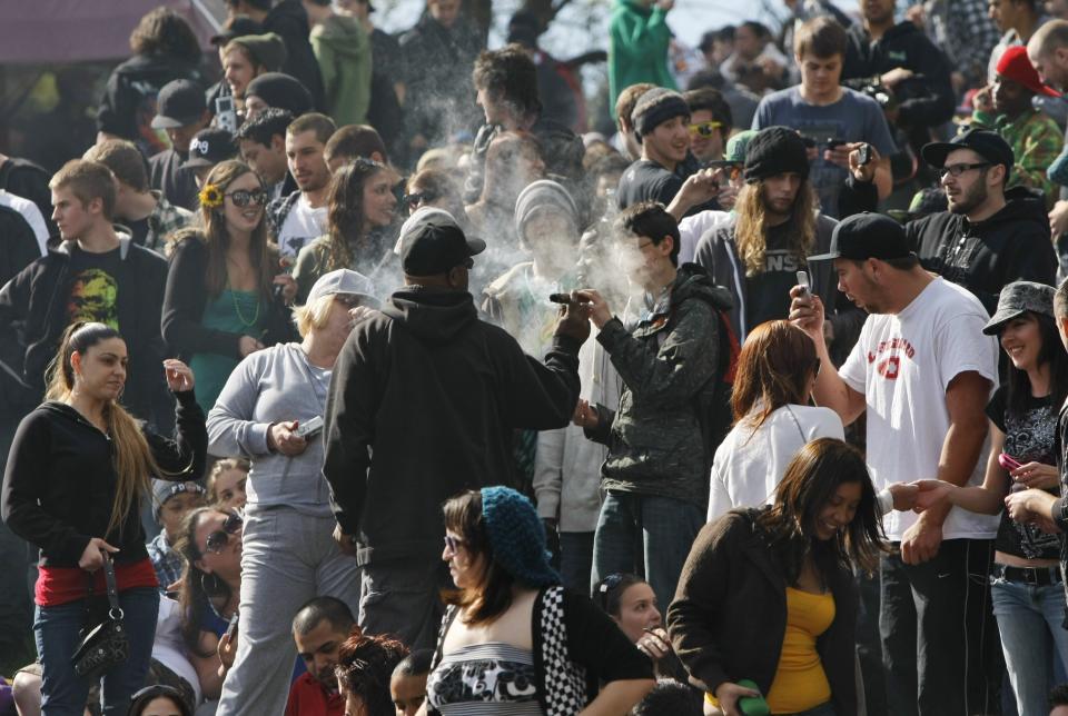 FILE - In this April 20, 2010, file photo smokers share marijuana at the Golden Gate Park in San Francisco. It was supposed to be a long weekend of festivals and music culminating on April 20, or 4/20, the code for marijuana’s high holiday. Instead, it has been reduced to an online replica because of stay-at-home orders to curb the pandemic. (AP Photo/Marcio Jose Sanchez, File)