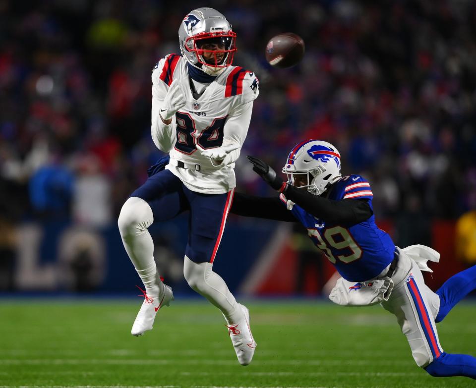 New England Patriots wide receiver Kendrick Bourne makes a catch against Buffalo Bills cornerback Levi Wallace in the AFC Wild Card playoff game on Jan. 15, 2022, at Highmark Stadium in Orchard Park, New York.