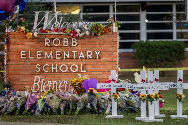 A memorial is seen Thursday surrounding the Robb Elementary School sign following Tuesday's mass shooting in Uvalde, Texas. (Photo: Brandon Bell via Getty Images)