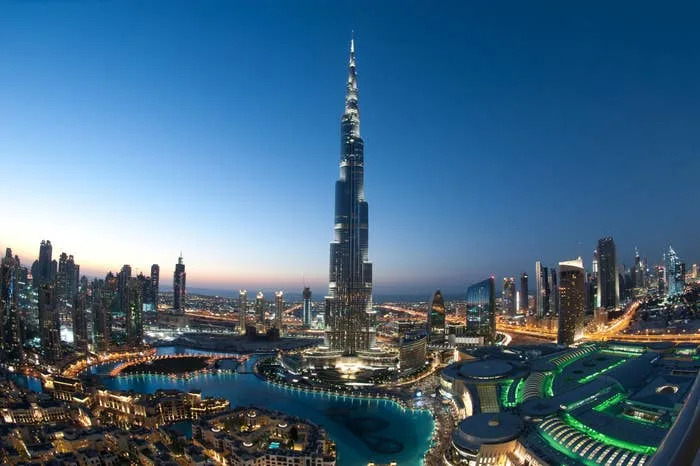 Skyline with the Burj Khalifa standing tall among other skyscrapers at dusk