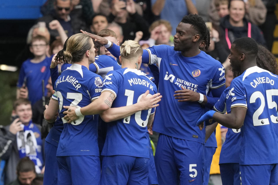 Chelsea players celebrate after Chelsea's Nicolas Jackson scored his side's fourth goal during the English Premier League soccer match between Chelsea and West Ham United at Stamford Bridge stadium in London, England, Sunday, May 5, 2024. (AP Photo/Frank Augstein)