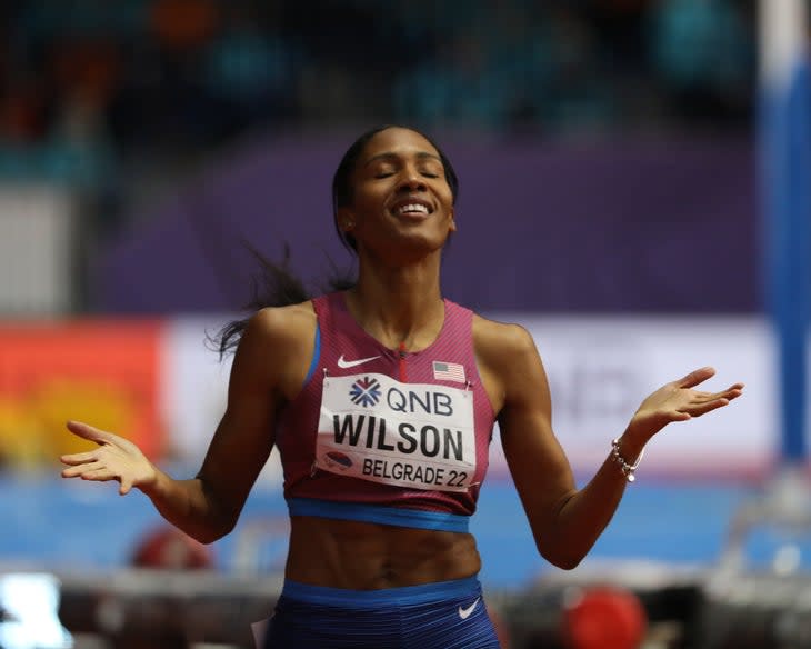 Ajee' Wilson with her palms up