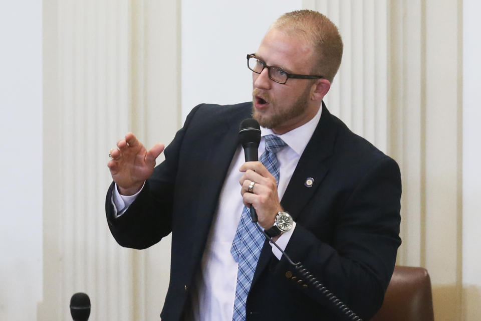 FILE - In this April, 17, 2017, file photo, state Rep. Collin Walke, D-Oklahoma City, speaks on the House floor in Oklahoma City. “It’s one thing to be able to claim a heritage, and it’s a whole other thing to respect what that heritage means,” said Rep. Walke, who is a Cherokee Nation citizen and the co-chair of the state's Native American legislative caucus. (AP Photo/Sue Ogrocki, File)